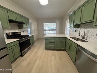 Welcome home to this recently updated 3-bedroom, 2-bath brick on Diamondhead Country Club in Mississippi - for sale on GolfHomes.com, golf home, golf lot