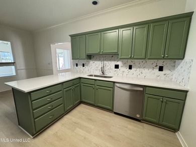 Welcome home to this recently updated 3-bedroom, 2-bath brick on Diamondhead Country Club in Mississippi - for sale on GolfHomes.com, golf home, golf lot