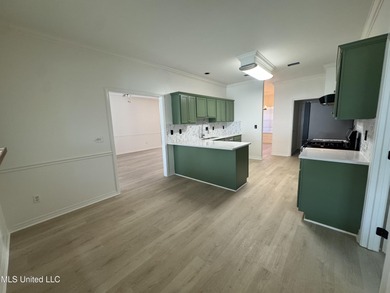 Welcome home to this recently updated 3-bedroom, 2-bath brick on Diamondhead Country Club in Mississippi - for sale on GolfHomes.com, golf home, golf lot