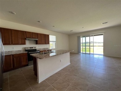 Enjoy Corner-Unit Townhouse with Golf Course Views -Davenport on Ridgewood Lakes Golf and Country Club in Florida - for sale on GolfHomes.com, golf home, golf lot