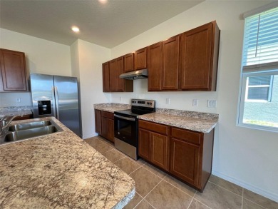 Enjoy Corner-Unit Townhouse with Golf Course Views -Davenport on Ridgewood Lakes Golf and Country Club in Florida - for sale on GolfHomes.com, golf home, golf lot