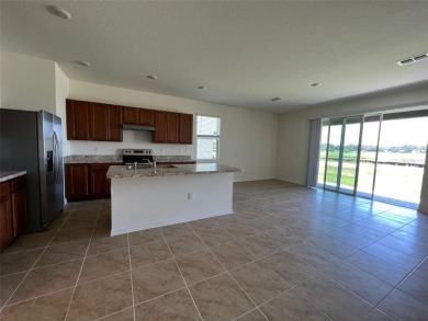 Enjoy Corner-Unit Townhouse with Golf Course Views -Davenport on Ridgewood Lakes Golf and Country Club in Florida - for sale on GolfHomes.com, golf home, golf lot