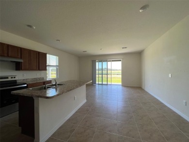 Enjoy Corner-Unit Townhouse with Golf Course Views -Davenport on Ridgewood Lakes Golf and Country Club in Florida - for sale on GolfHomes.com, golf home, golf lot