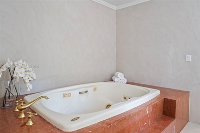 Rare mediterranean estate exuding sophistication and beach vibes on Miami Beach Golf Club in Florida - for sale on GolfHomes.com, golf home, golf lot