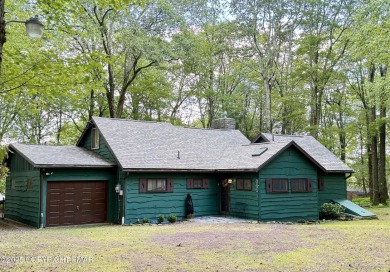Rustic mountain escape with warm wood features! This 3 bedroom on Split Rock Resort and Country Club in Pennsylvania - for sale on GolfHomes.com, golf home, golf lot