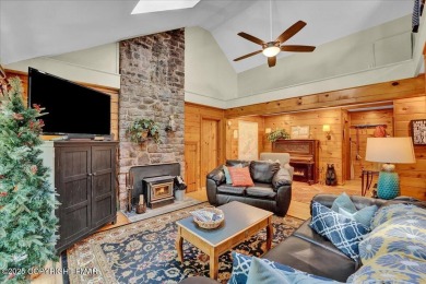 Rustic mountain escape with warm wood features! This 3 bedroom on Split Rock Resort and Country Club in Pennsylvania - for sale on GolfHomes.com, golf home, golf lot