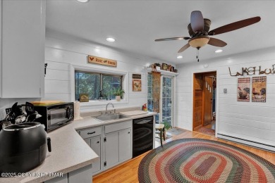 Rustic mountain escape with warm wood features! This 3 bedroom on Split Rock Resort and Country Club in Pennsylvania - for sale on GolfHomes.com, golf home, golf lot