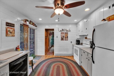 Rustic mountain escape with warm wood features! This 3 bedroom on Split Rock Resort and Country Club in Pennsylvania - for sale on GolfHomes.com, golf home, golf lot