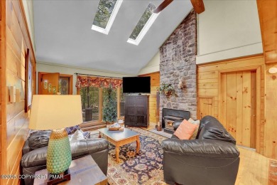 Rustic mountain escape with warm wood features! This 3 bedroom on Split Rock Resort and Country Club in Pennsylvania - for sale on GolfHomes.com, golf home, golf lot