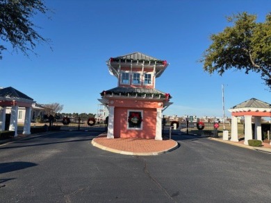 Generous lot directly overlooking the fountain at Crystal Lake on Bay Creek Golf Club in Virginia - for sale on GolfHomes.com, golf home, golf lot