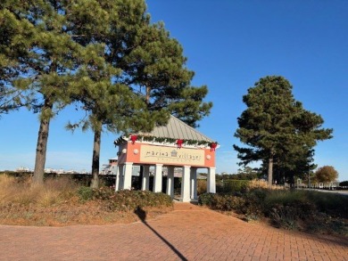 Generous lot directly overlooking the fountain at Crystal Lake on Bay Creek Golf Club in Virginia - for sale on GolfHomes.com, golf home, golf lot