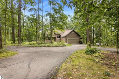 Enjoy a peaceful, wooded retreat. This charming property offers on Black Forest At Wilderness Valley in Michigan - for sale on GolfHomes.com, golf home, golf lot
