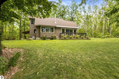 Enjoy a peaceful, wooded retreat. This charming property offers on Black Forest At Wilderness Valley in Michigan - for sale on GolfHomes.com, golf home, golf lot