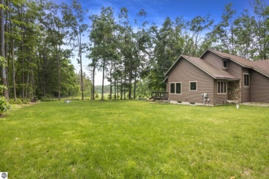 Enjoy a peaceful, wooded retreat. This charming property offers on Black Forest At Wilderness Valley in Michigan - for sale on GolfHomes.com, golf home, golf lot