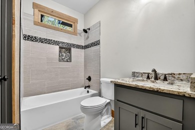 Overlooking a serene hidden lake-known by some residents as on White Path Golf Club in Georgia - for sale on GolfHomes.com, golf home, golf lot