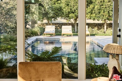 Tucked behind the guarded gates of the exclusive Malibu Colony on Calabasas Golf and Country Club in California - for sale on GolfHomes.com, golf home, golf lot