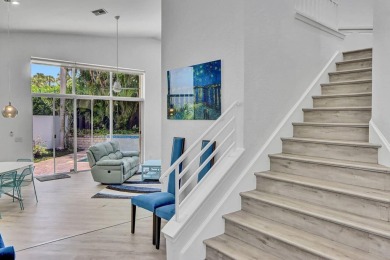 Light & open, this lovely 2-story home of 3 bedrooms & 2 1/2 on Woodfield Country Club in Florida - for sale on GolfHomes.com, golf home, golf lot
