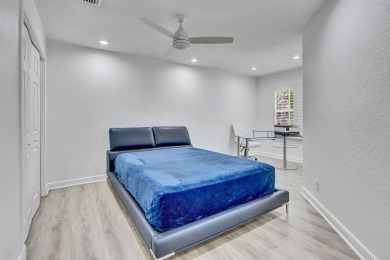 Light & open, this lovely 2-story home of 3 bedrooms & 2 1/2 on Woodfield Country Club in Florida - for sale on GolfHomes.com, golf home, golf lot