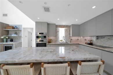 Casa Delfin is a move-in ready dream home, currently configured on Deering Bay Yacht and Country Club in Florida - for sale on GolfHomes.com, golf home, golf lot
