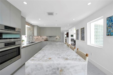 Casa Delfin is a move-in ready dream home, currently configured on Deering Bay Yacht and Country Club in Florida - for sale on GolfHomes.com, golf home, golf lot