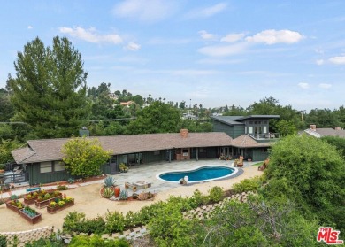 Perched above the Woodland Hills Country Club, this classic 1953 on Woodland Hills Country Club in California - for sale on GolfHomes.com, golf home, golf lot