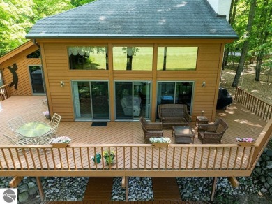 Tucked away in a private setting with frontage on the 13th hole on Schuss Mountain Golf Club in Michigan - for sale on GolfHomes.com, golf home, golf lot