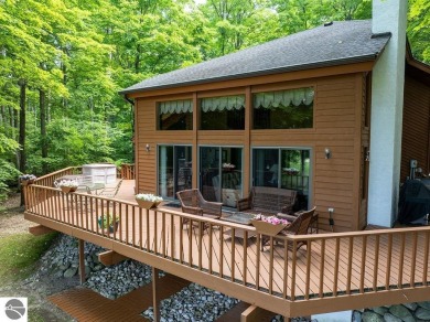 Tucked away in a private setting with frontage on the 13th hole on Schuss Mountain Golf Club in Michigan - for sale on GolfHomes.com, golf home, golf lot