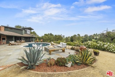 Perched above the Woodland Hills Country Club, this classic 1953 on Woodland Hills Country Club in California - for sale on GolfHomes.com, golf home, golf lot