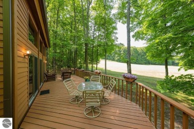Tucked away in a private setting with frontage on the 13th hole on Schuss Mountain Golf Club in Michigan - for sale on GolfHomes.com, golf home, golf lot