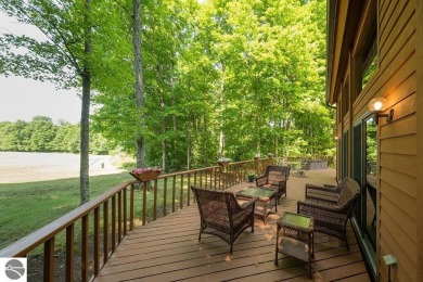Tucked away in a private setting with frontage on the 13th hole on Schuss Mountain Golf Club in Michigan - for sale on GolfHomes.com, golf home, golf lot