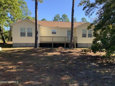 This 3 bedroom 2 bath home in Boiling Spring Lakes provides both on The Lakes Country Club in North Carolina - for sale on GolfHomes.com, golf home, golf lot