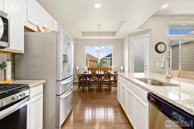 Low-maintenance living near the Poudre River Trail! Set in the on Boomerang Links in Colorado - for sale on GolfHomes.com, golf home, golf lot