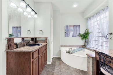 Tucked inside a gated, resort-style community, this home offers on The Golf Club at Resort Eagle Mountain Lake in Texas - for sale on GolfHomes.com, golf home, golf lot