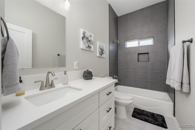 This contemporary home is located in the beautiful and gated Los on Los Lagos Golf Club in Arizona - for sale on GolfHomes.com, golf home, golf lot
