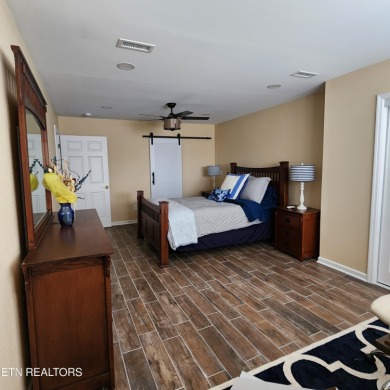 Beautifully remodeled four-bedroom home with a three-car garage on Tellico Village -The Links At Kahite Golf Course in Tennessee - for sale on GolfHomes.com, golf home, golf lot