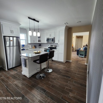 Beautifully remodeled four-bedroom home with a three-car garage on Tellico Village -The Links At Kahite Golf Course in Tennessee - for sale on GolfHomes.com, golf home, golf lot