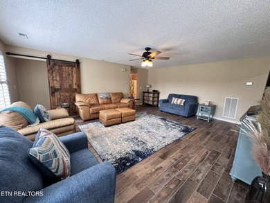 Main level boast upgraded kitchen with granite countertops, tile on Tellico Village -The Links At Kahite Golf Course in Tennessee - for sale on GolfHomes.com, golf home, golf lot