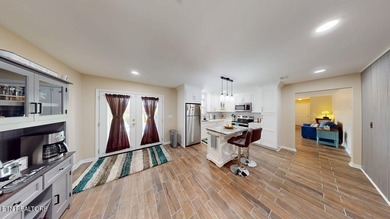 Main level boast upgraded kitchen with granite countertops, tile on Tellico Village -The Links At Kahite Golf Course in Tennessee - for sale on GolfHomes.com, golf home, golf lot