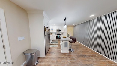 Main level boast upgraded kitchen with granite countertops, tile on Tellico Village -The Links At Kahite Golf Course in Tennessee - for sale on GolfHomes.com, golf home, golf lot