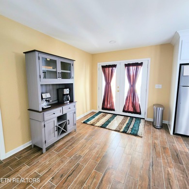 Main level boast upgraded kitchen with granite countertops, tile on Tellico Village -The Links At Kahite Golf Course in Tennessee - for sale on GolfHomes.com, golf home, golf lot