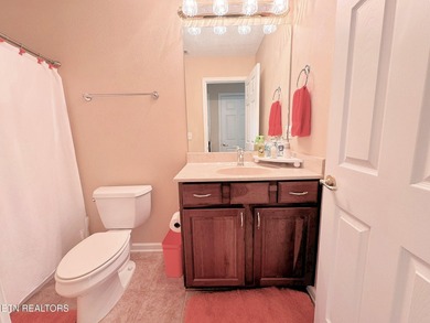 Main level boast upgraded kitchen with granite countertops, tile on Tellico Village -The Links At Kahite Golf Course in Tennessee - for sale on GolfHomes.com, golf home, golf lot