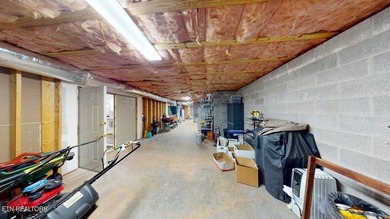 Main level boast upgraded kitchen with granite countertops, tile on Tellico Village -The Links At Kahite Golf Course in Tennessee - for sale on GolfHomes.com, golf home, golf lot