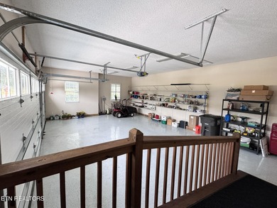 Main level boast upgraded kitchen with granite countertops, tile on Tellico Village -The Links At Kahite Golf Course in Tennessee - for sale on GolfHomes.com, golf home, golf lot