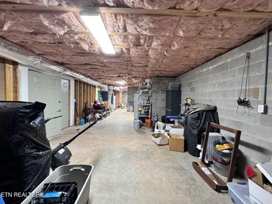 Main level boast upgraded kitchen with granite countertops, tile on Tellico Village -The Links At Kahite Golf Course in Tennessee - for sale on GolfHomes.com, golf home, golf lot