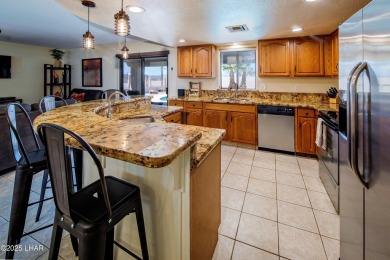 Welcome to 701 Paseo Granada!  This fully furnished pool home is on London Bridge Golf Course in Arizona - for sale on GolfHomes.com, golf home, golf lot