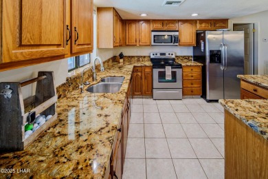 Welcome to 701 Paseo Granada!  This fully furnished pool home is on London Bridge Golf Course in Arizona - for sale on GolfHomes.com, golf home, golf lot
