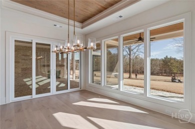 Nestled on the *Black 4* Fairway of The Georgia Club, this on The Georgia Club in Georgia - for sale on GolfHomes.com, golf home, golf lot
