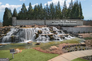 Welcome home to this beautifully maintained Dunwoody plan, one on Canongate Golf At Sun City Peachtree in Georgia - for sale on GolfHomes.com, golf home, golf lot
