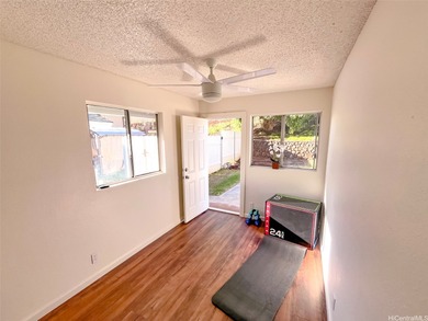 Welcome to this charming 4-bedroom, 2-bath home nestled in a on Mililani Golf Club in Hawaii - for sale on GolfHomes.com, golf home, golf lot