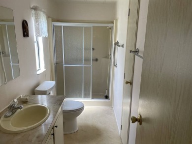 Immaculate two bedroom, two bath home with a two-car garage in on Del Tura Golf and Country Club in Florida - for sale on GolfHomes.com, golf home, golf lot